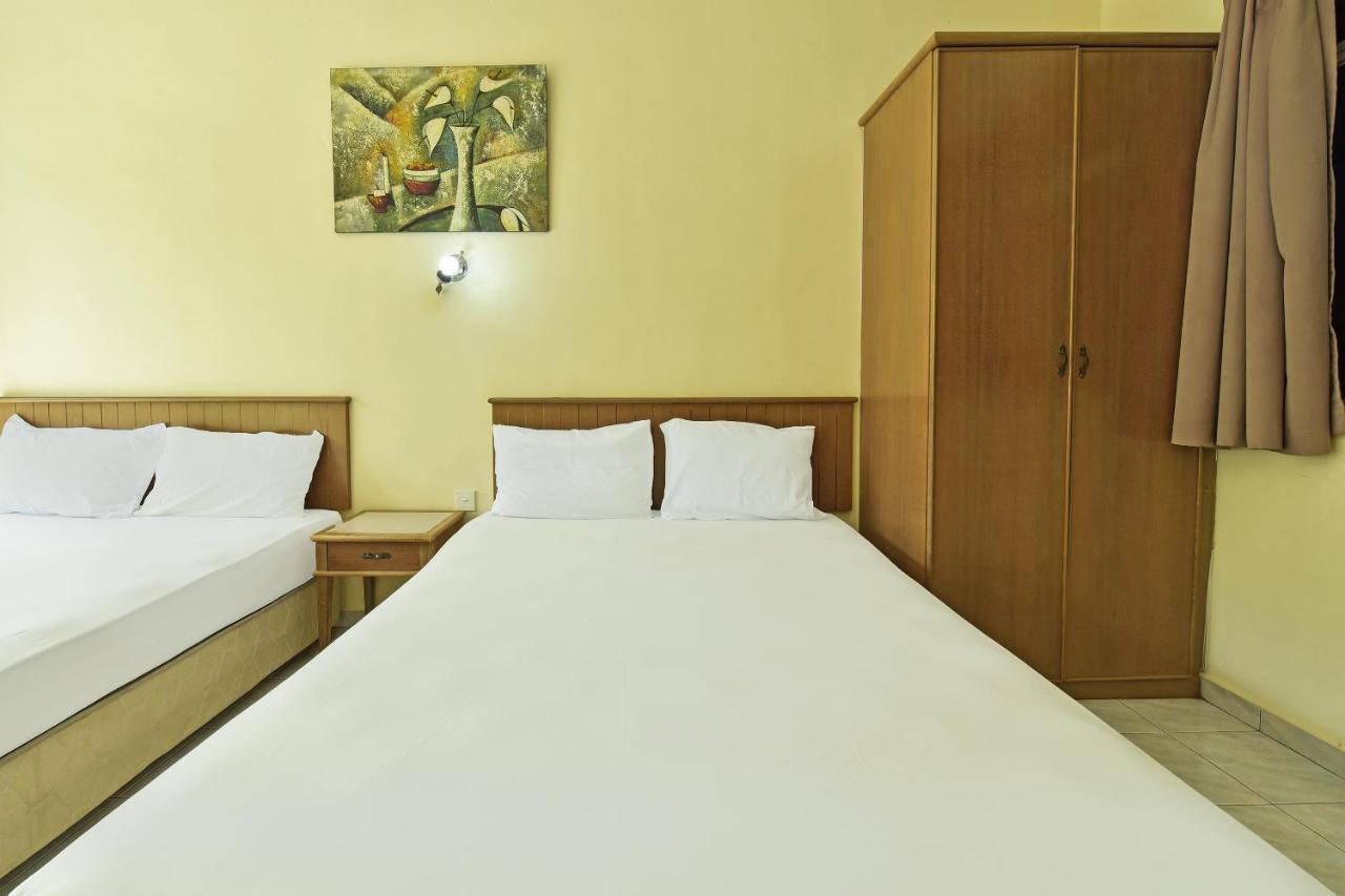 Oyo Home 90700 Teluk Batik Holiday Apartment Kampong Telok Batu Экстерьер фото
