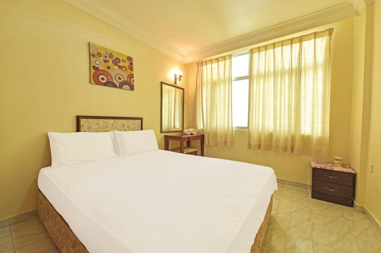 Oyo Home 90700 Teluk Batik Holiday Apartment Kampong Telok Batu Экстерьер фото
