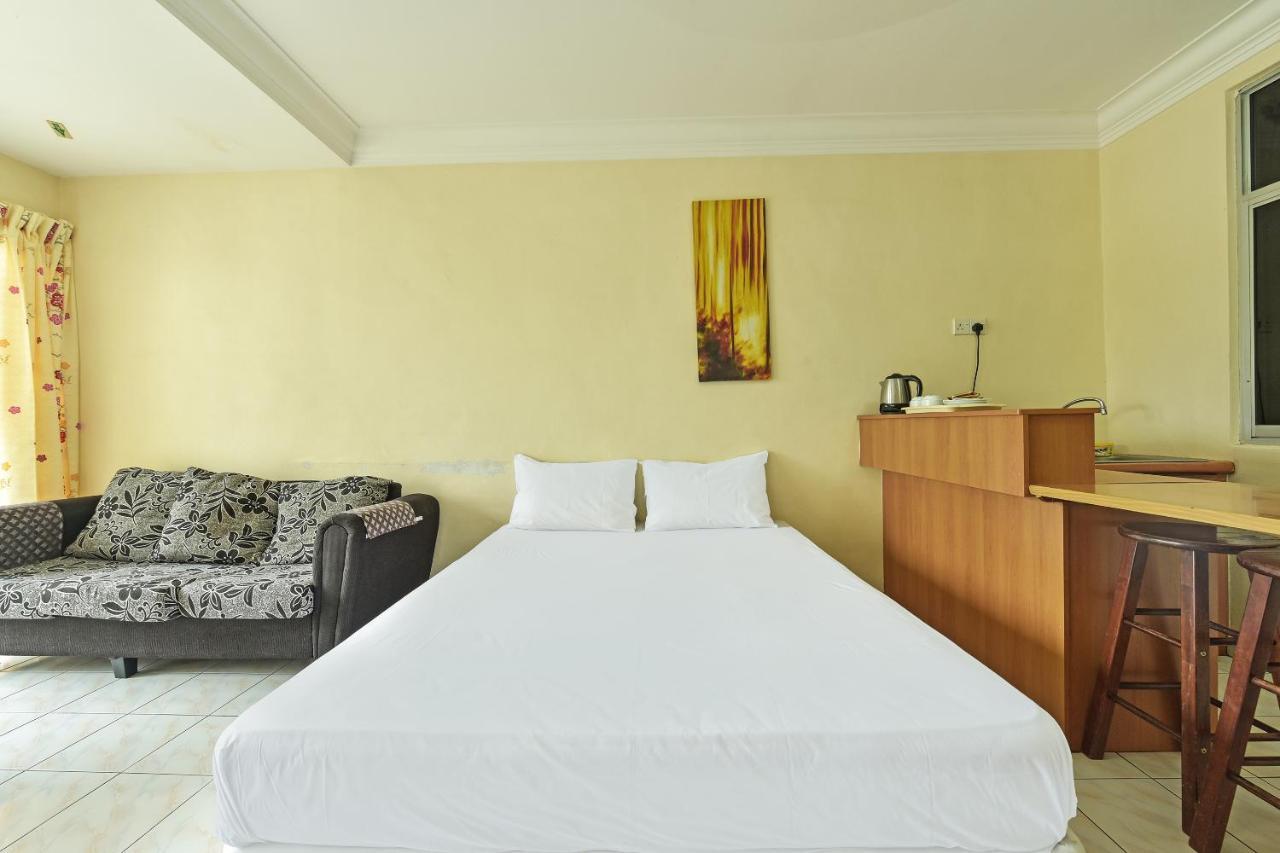 Oyo Home 90700 Teluk Batik Holiday Apartment Kampong Telok Batu Экстерьер фото